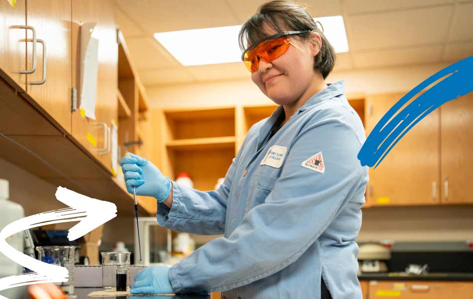 Student wearing a lab coat, safety glasses, and gloves using a pipette to transfer liquid into a sample container in a science laboratory, with cabinets and lab equipment visible in the background.