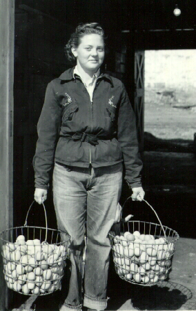 Floy Bader gathering eggs 1940