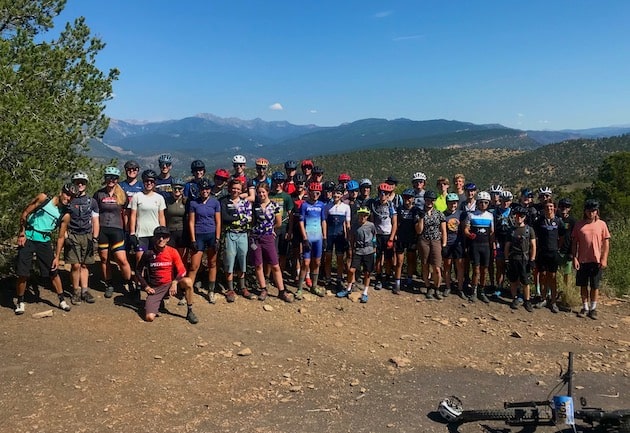 Cycling camp group posing in front of the Animas Valley